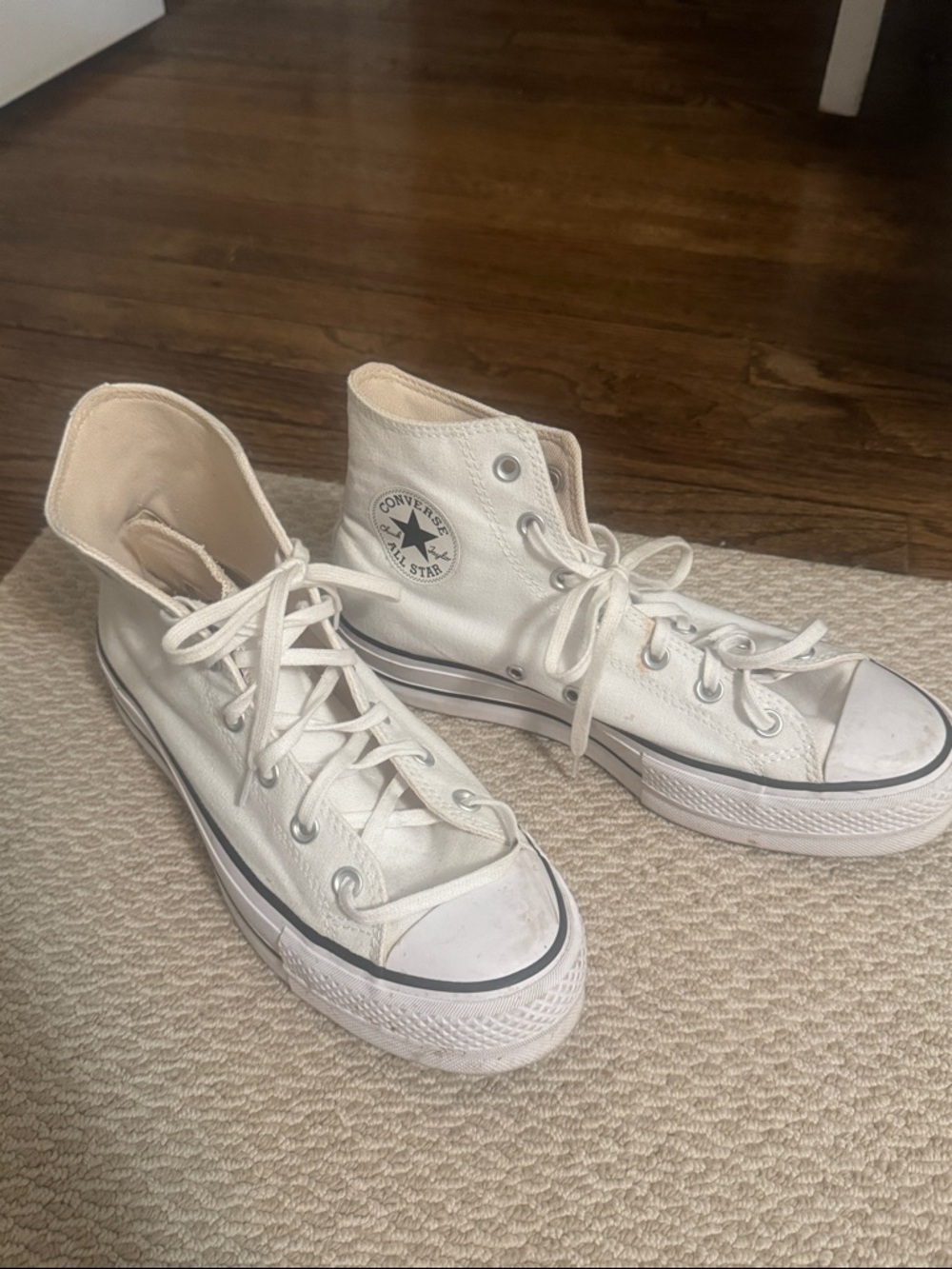 Converse white high top sneakers with black trim